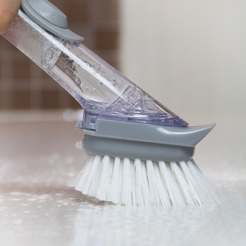 Dishwashing brush with integrated detergent dispenser